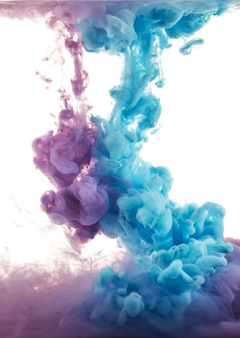 color splashes of ink in water isolated on white